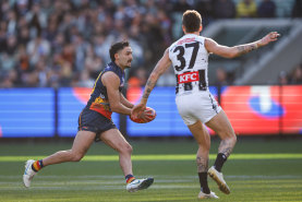 Izak Rankine breaks free for the Crows.