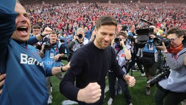 Xabi Alonso of Bayer Leverkusen celebrates the German championship.