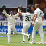 Alex Carey and Pat Cummins celebrate Jonny Bairstow’s wicket.