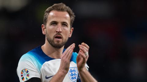 Harry Kane applauds fans