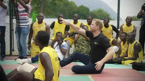 Prince Harry playing volleball