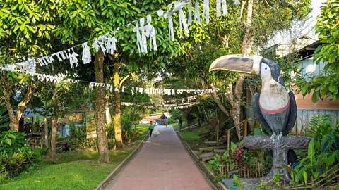 Town sign Puerto Nariño overlooking the Amazon River