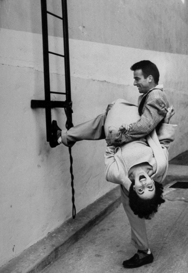 r/OldSchoolCool - Elizabeth Taylor and Montgomery Clift goof around during a break in filming 'A Place in the Sun'. Photo by Peter Stackpole 1950