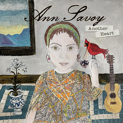Album art with illustration of a woman with a red cardinal perched on one hand. Her shirt is a collage of city maps, and behind her is an acoustic guitar, a potted flower, and a window or painting.