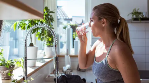 Woman drinking glass of water