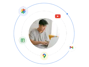 A man using a laptop is surrounded by an illustrated ecosystem of Google Ad format types