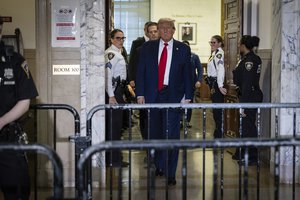 Donald Trump leaving the courtroom during a break in his civil business fraud trial