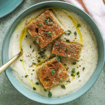 Creamy cauliflower and potato soup topped with mini cheese toastie bites.