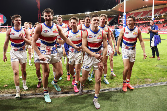 Marcus Bontempelli (L) and Taylor Duryea (R) of the Bulldogs celebrate their victory ove GWS.