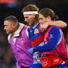 MELBOURNE, AUSTRALIA - MAY 23: Aaron Naughton of the Bulldogs reacts to an injury during the round 11 AFL match between Western Bulldogs and Sydney Swans at Marvel Stadium, on May 23, 2024, in Melbourne, Australia. (Photo by Morgan Hancock/Getty Images)