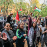 Protesting students rally outside the Arts West building at University of Melbourne on Friday afternoon.