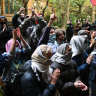 Students rally at the Pro-Palestine encampment at the University of Melbourne on Friday.