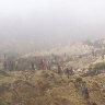 Villagers search the site of a  landslide that struck villages in the Southern Highlands mountainous region of central Papua New Guinea a few years ago.