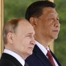 Chinese President Xi Jinping, left, and Russian President Vladimir Putin review the honor guard during an official welcome ceremony in Beijing, China, Thursday, May 16, 2024. (Sergei Bobylev, Sputnik, Kremlin Pool Photo via AP)