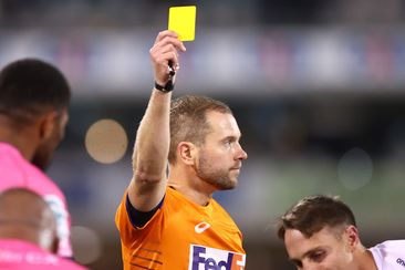 Referee Angus Gardner gives a yellow card to Darby Lancaster of the Rebels during the round 14 Super Rugby Pacific match between ACT Brumbies and Melbourne Rebels.