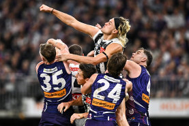 Darcy Moore makes a spoil.