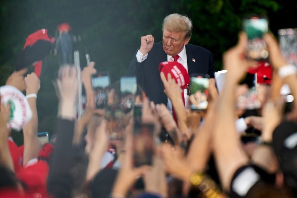 Former US President Donald Trump dances during a campaign event at Crotona Park in the Bronx.