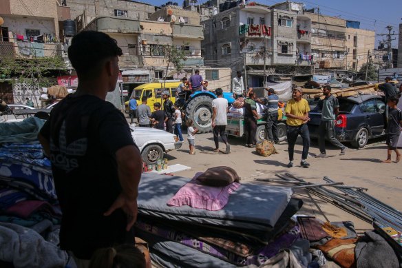 Displaced Palestinians in Rafah pack up their belongings, to leave for a safer place.