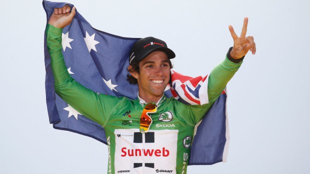 Australia's Michael Matthews celebrates after claiming the green jersey.