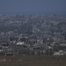 Destroyed buildings in the Gaza Strip, as seen from southern Israel, Friday, May 24, 2024. (AP Photo/Tsafrir Abayov)