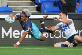 Lotu Inisi of Moana Pasifika scores a try against the Waratahs.