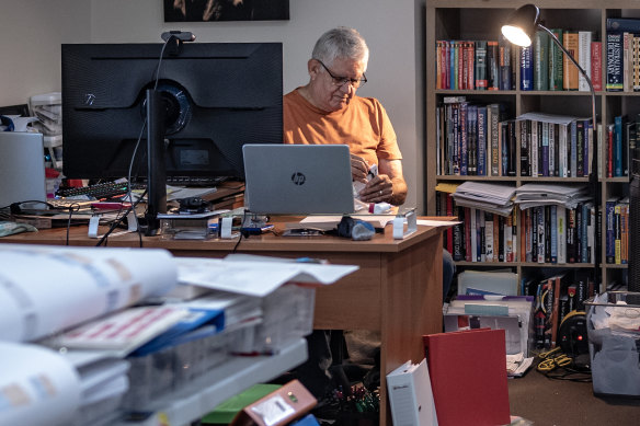 Ken Wyatt in his study surrounded by “native welfare” files. Spanning a century, they show in painful detail how cruel policies affected four generations of his family.