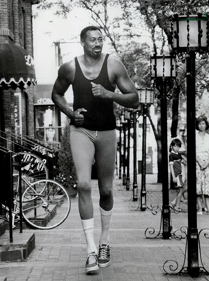 r/nba - Here is a picture of Wilt Chamberlain walking down a street. That's all.