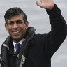 Britain’s Prime Minister and Conservative Party leader Rishi Sunak, right, and Britain’s Northern Ireland Secretary Chris Heaton-Harris wait on board an Artemis Technologies boat before a tour during a visit to the maritime technology centre at a dockyard in Belfast, on Friday.