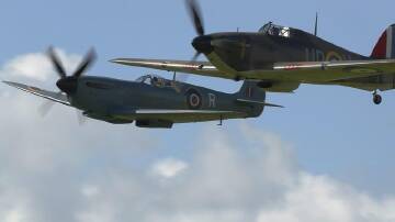 A Spitfire aircraft (l) at an event commemorating the Battle of Britain, together with a Hurricane. (EPA PHOTO)