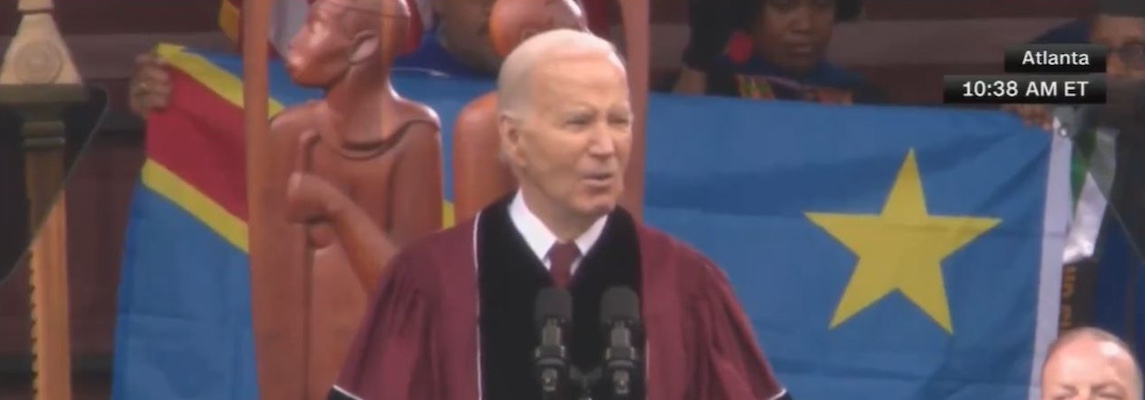 The Congolese flag being held behind President Joe Biden 