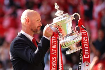 Erik ten Hag, Manager of Manchester United celebrates with the trophy during the Emirates FA Cup Final match between Manchester City and Manchester United at Wembley Stadium on May 25, 2024 in London, England. (Photo by Alex Pantling/Getty Images )