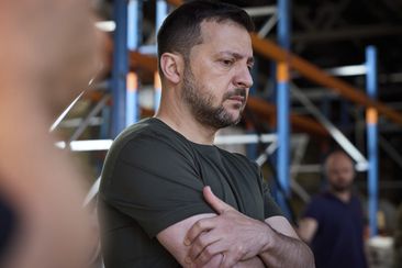 Ukraine&#x27;s President Volodymyr Zelenskyy looks at burnt books in a damaged workshop of Ukraine&#x27;s largest printing house ruined in Thursday deadly Russian missile attack that killed seven civilians in Kharkiv, Ukraine, Friday, May 24, 2024. 