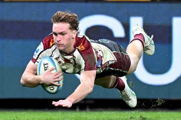 Tim Ryan of the Reds dives over to score a try during the round 14 Super Rugby Pacific match between Queensland Reds and Western Force.