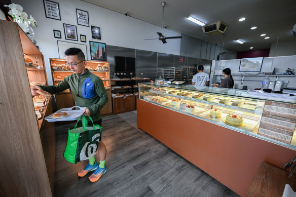 Manna customers pick up a tray then inch their way along the shelves.