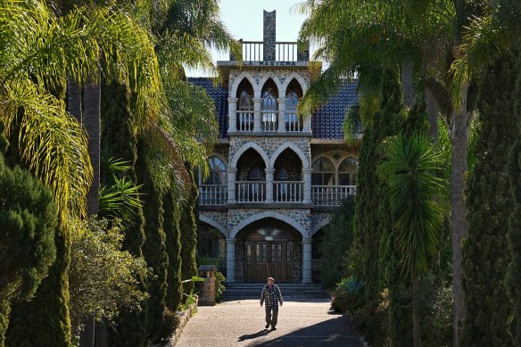 Galliano Callegari in front of his home and gardens, which include a moat.