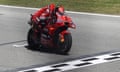 Francesco Bagnaia crosses the line first at the Catalunya Grand Prix.