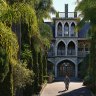 Galliano Callegari in front of his home and gardens, which include a moat.