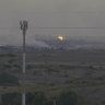 A screenshot of footage from southern Israel that shows flames and smoke rising from what Palestinian medics say is an Israeli airstrike in Gaza.