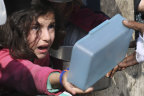 Palestinians line up for food amid the Israeli air and ground offensive.