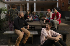 Kelly (front) and his group of friends, who bought a block of units together in Sydney.