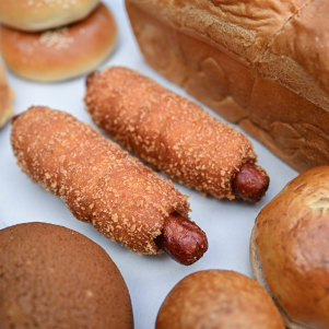 The “fried sausage roll” (centre) is wrapped in milk bread rolled in panko crumbs.