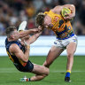 Crows tackler Rory Laird tries to strip the ball from Eagle Harley Reid at the weekend.