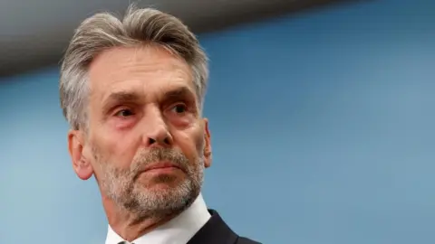 Former Dutch intelligence chief Dick Schoof looks on at a press conference as he is presented as the proposed prime minister of the Netherlands