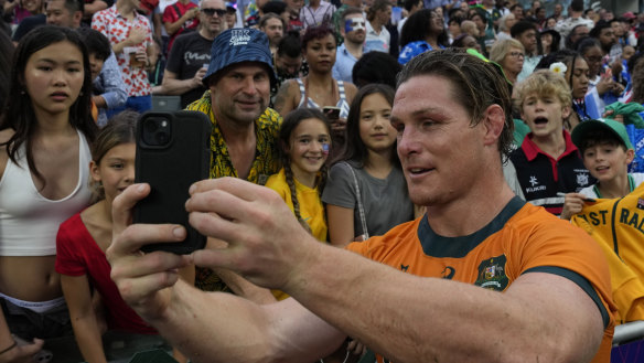 Michael Hooper takes a selfie with fans at the Hong Kong Sevens in April.