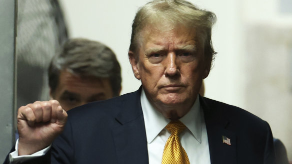 Former President Donald Trump walks to the courtroom at Manhattan criminal court on Wednesday. 