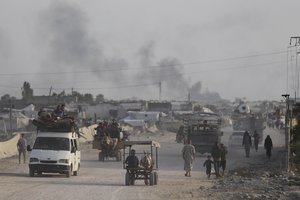 Palestinians fleeing from the southern Gaza city of Rafah during an Israeli ground and air offensive in the city on Tuesday, May 28, 2024.