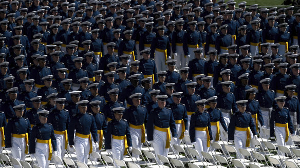 The United States Air Force Academy Class of 2024 march to their seats at the start of the commencement ceremony at Falcon Stadium in Colorado Springs, Colorado.