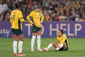 Caitlin Foord reacts after an injury during the international friendly match between the Matildas and China.