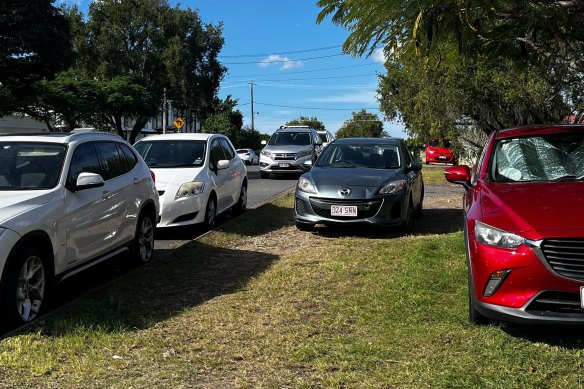 Cars parked on the footpath and kerb at Norman Park.