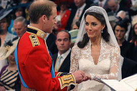 William places a wedding ring on Kate in 2011. The prince prefers not to wear his wedding band. 